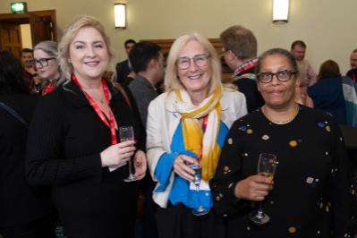 three ladies smiling